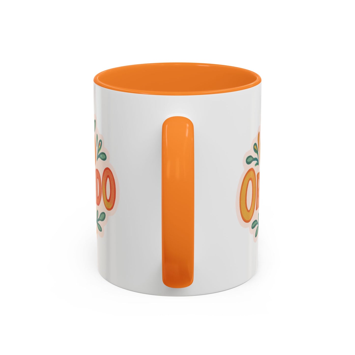 white ceramic mug with 'Orlando' written in orange lettering, accompanied by a graphic of orange and green leaves. The mug has an orange interior and handle.