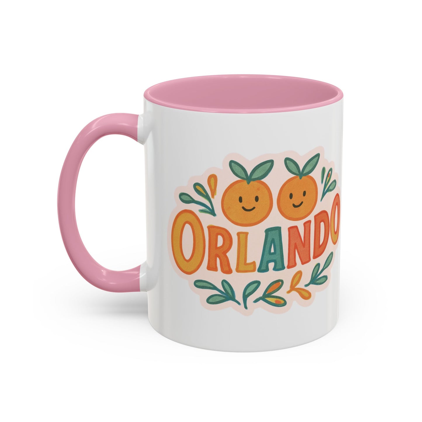 white ceramic mug with 'Orlando' written in orange lettering, accompanied by a graphic of orange and green leaves. The mug has a pink interior and handle.