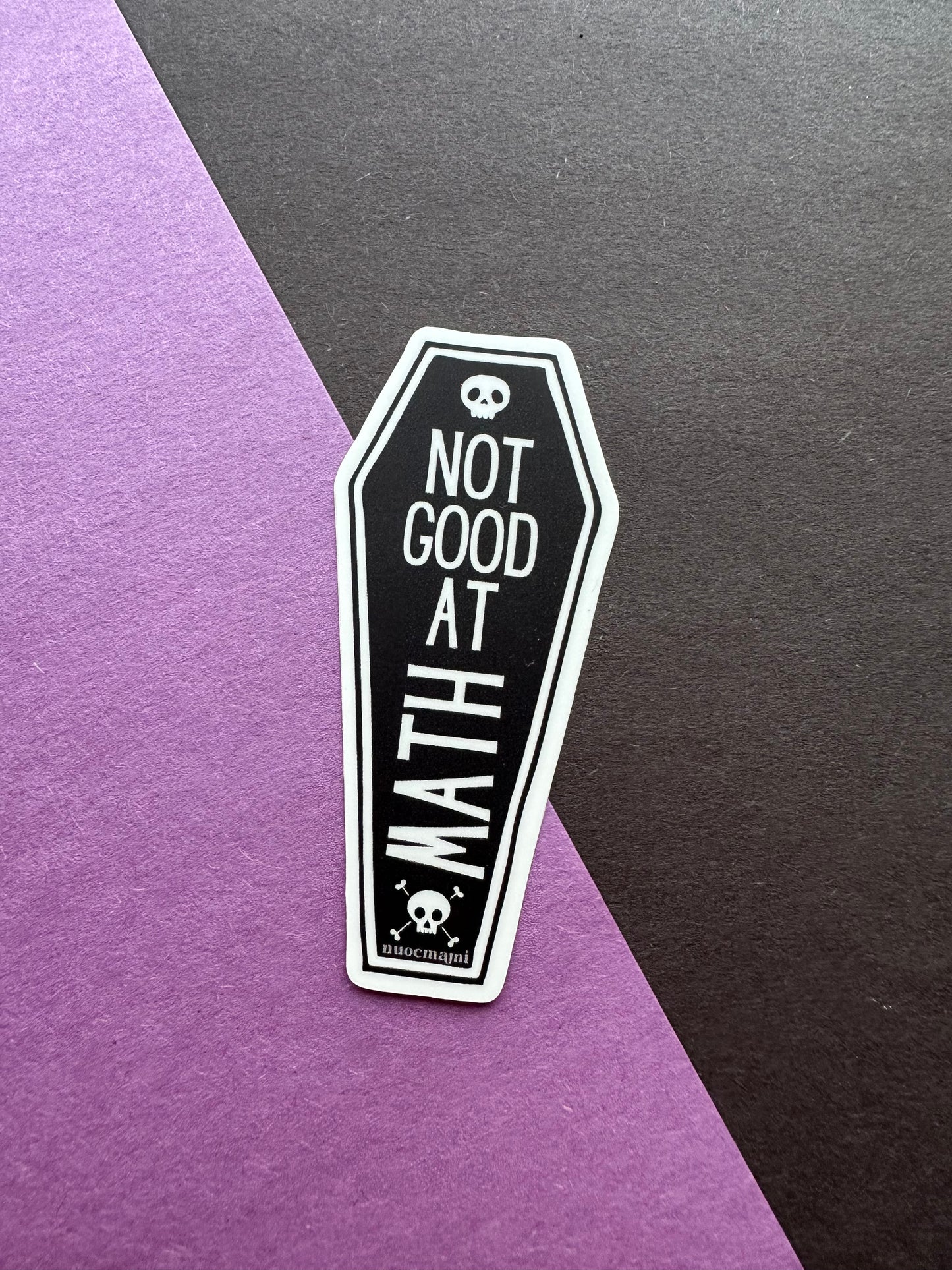 Coffin-shaped sticker with 'Not Good At Math' text