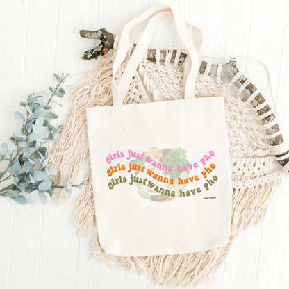 Canvas tote bag with the text 'Girls just wanna have Pho' printed on the front,  