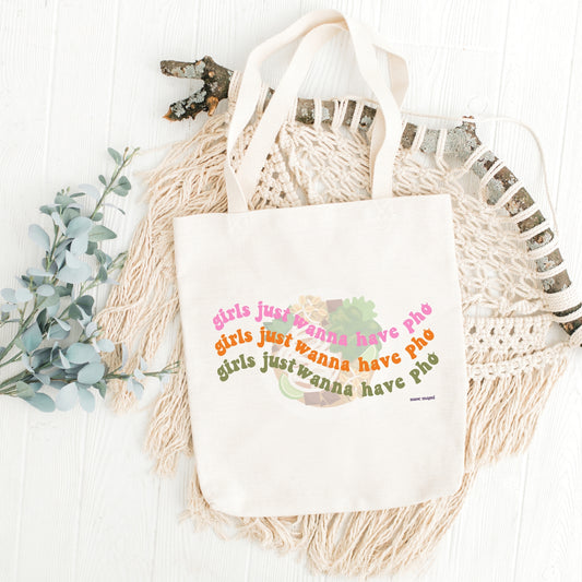 Canvas tote bag with the text 'Girls just wanna have Pho' printed on the front,  