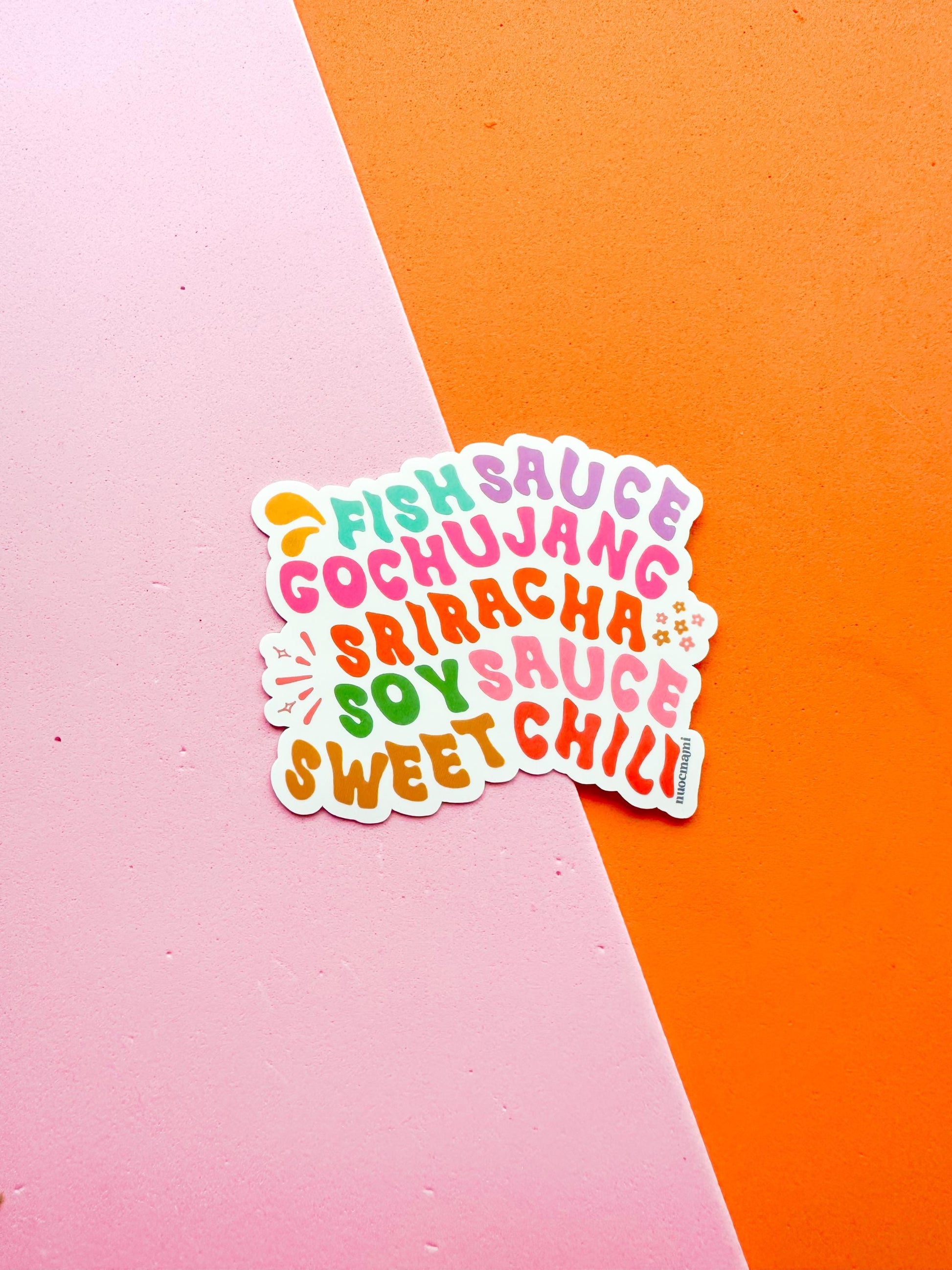 A colorful vinyl sticker with the text 'FISH SAUCE, GOCHUJANG, SOY SAUCE, SRIRACHA, SWEET CHILI' arranged in a playful font 