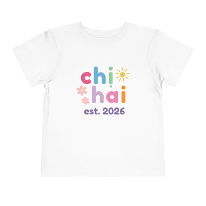 White t-shirt with colorful text chi hai est. 2026
