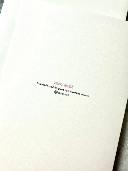 greeting card back with text nuoc mami handmade goods inspired by vietnamese culture with instagram handle @nuocmami
