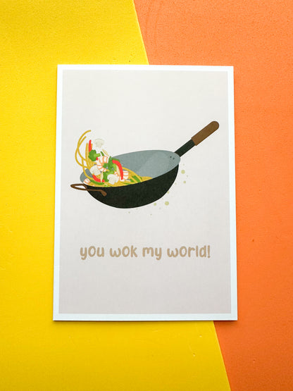 Greeting card with an illustration of a wok and the phrase 'you wok my world' 