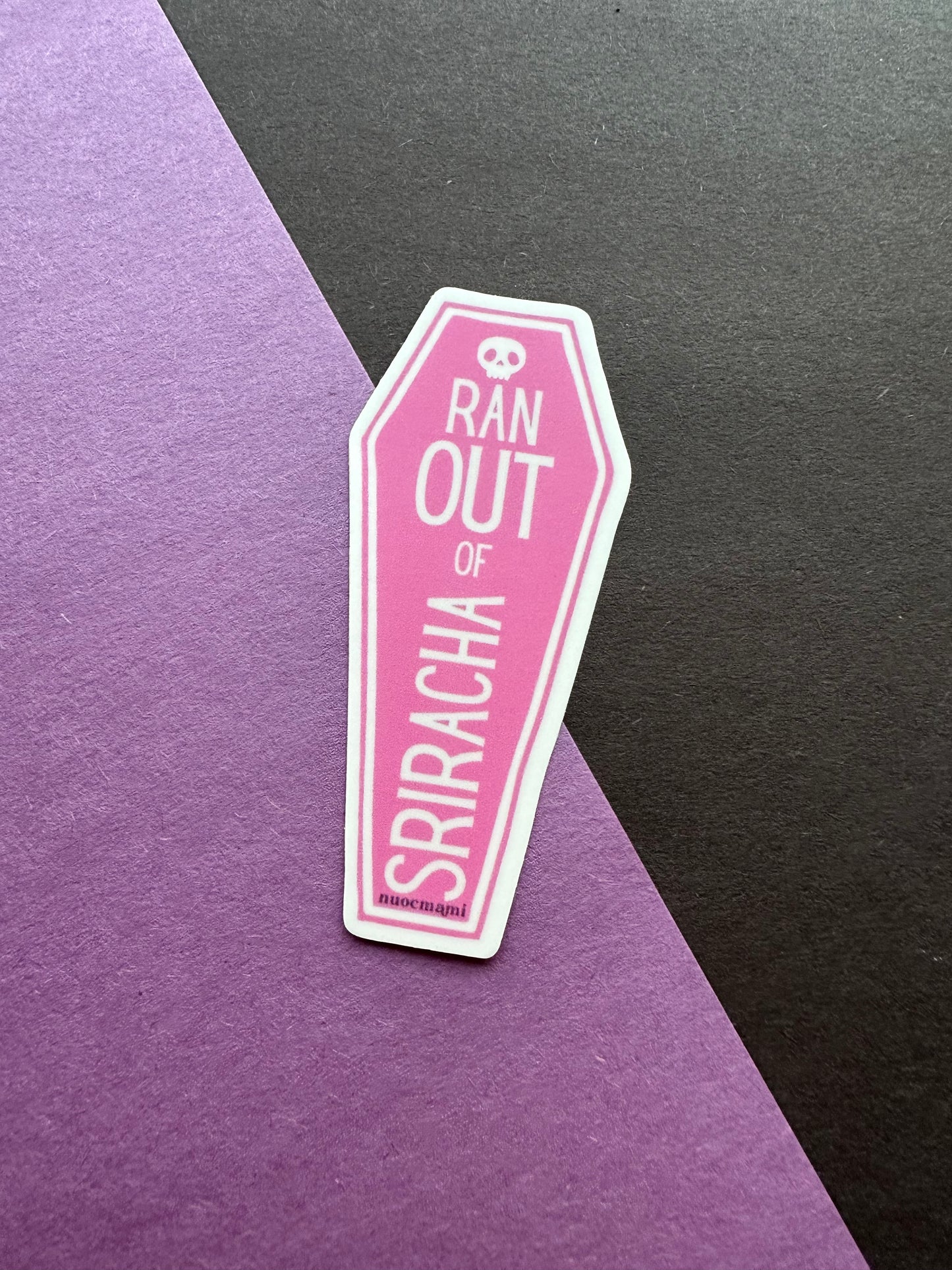 Pink coffin-shaped sticker with 'Ran Out of Sriracha' text
