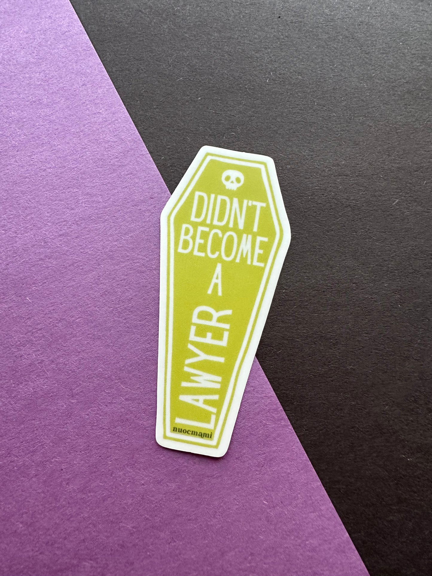 Sticker shaped like a coffin with text didnt become a lawyer