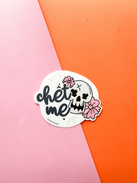Sticker with skull and flowers design and a text chet me