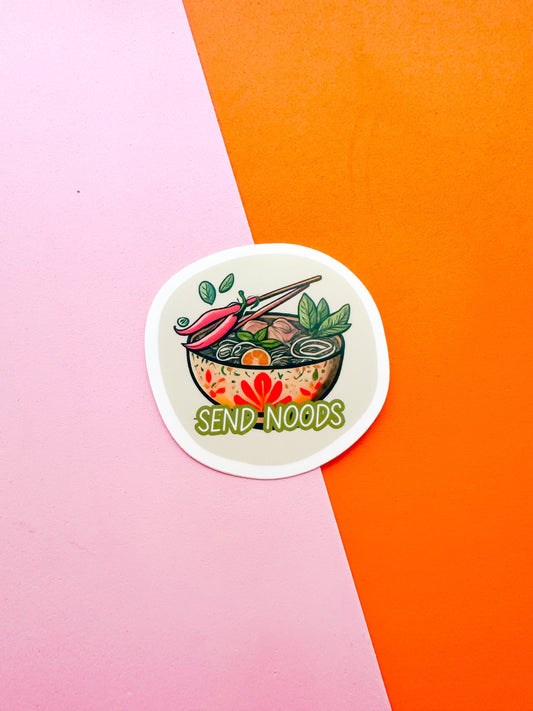 A round vinyl sticker with an illustration of a bowl of pho soup and the text 'SEND NOODS'  