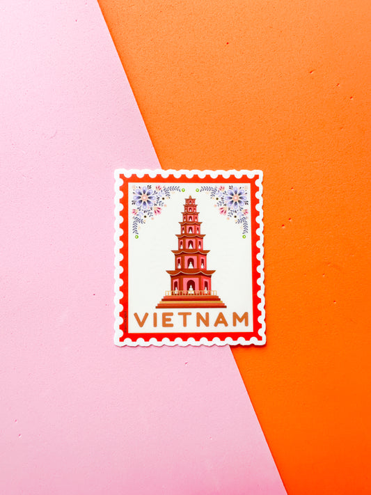 Sticker of a tower with 'Vietnam' text on a pink and orange background